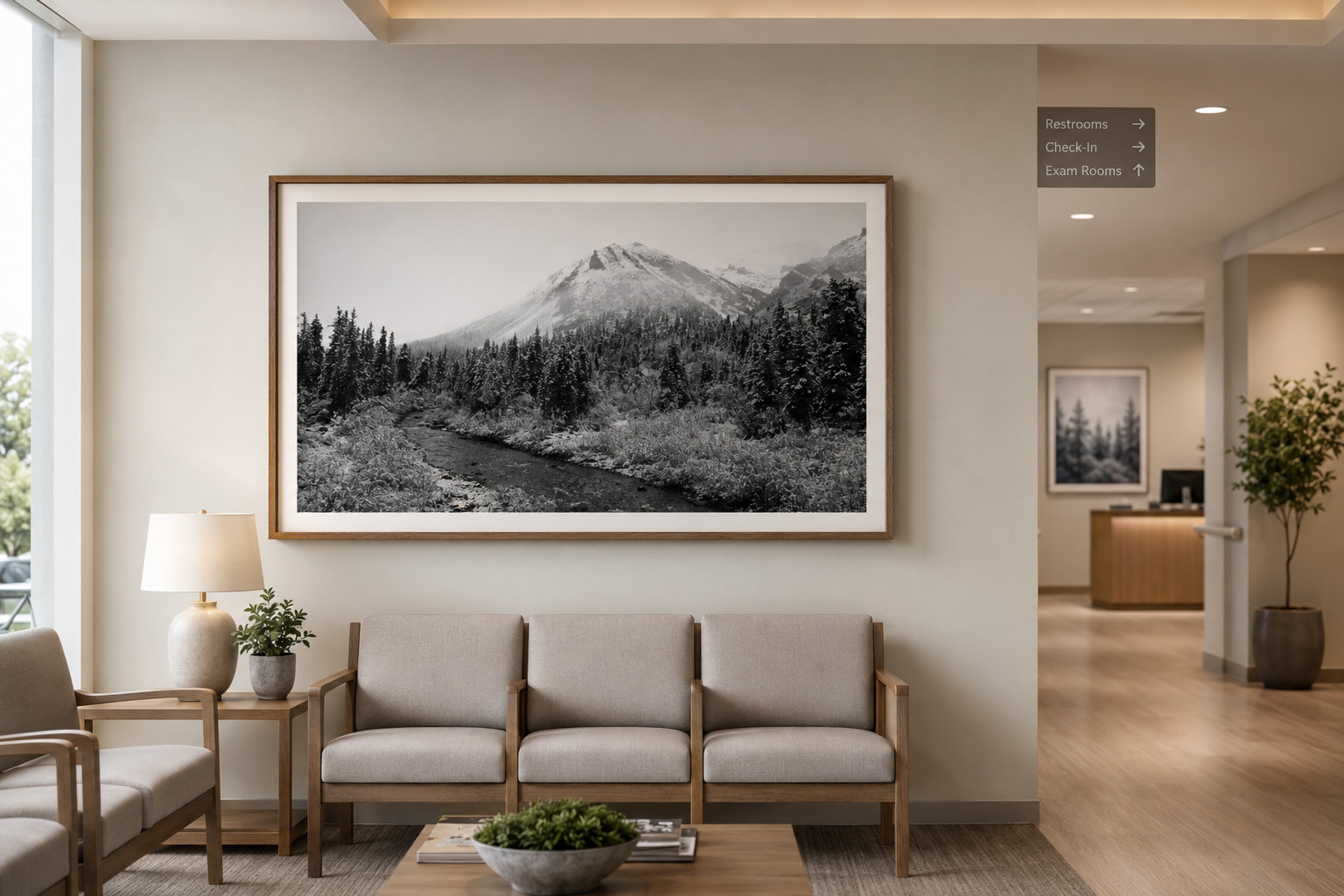 Healthcare waiting room with black and white mountain landscape photography by Dan Sproul